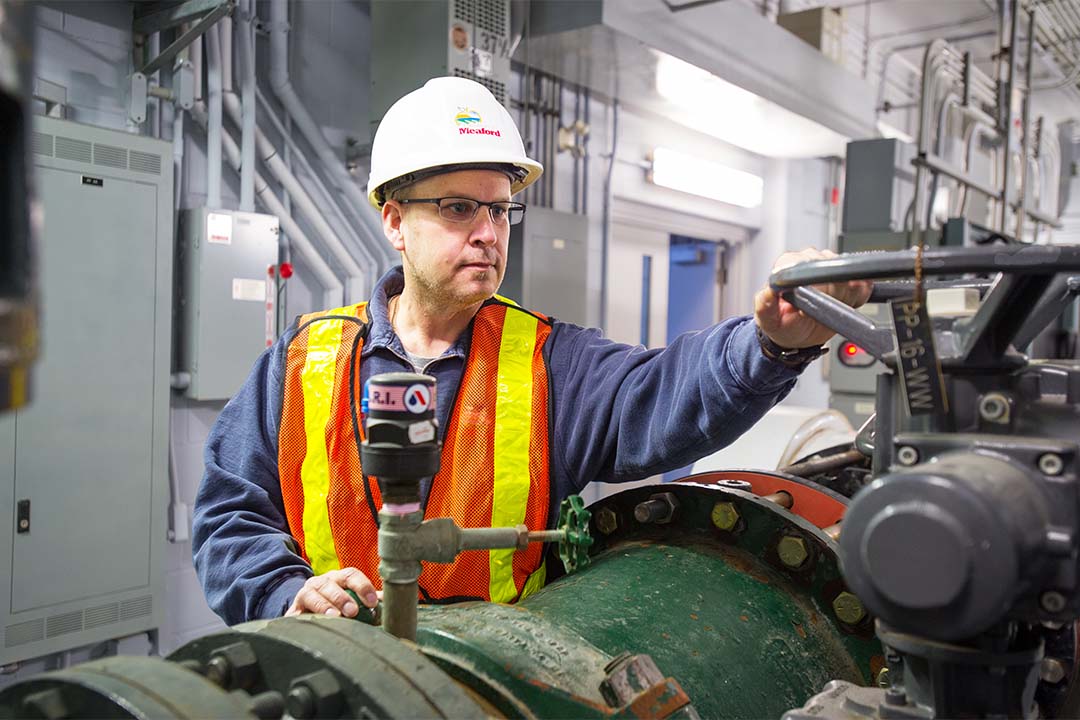 male employee working in water treatment plant