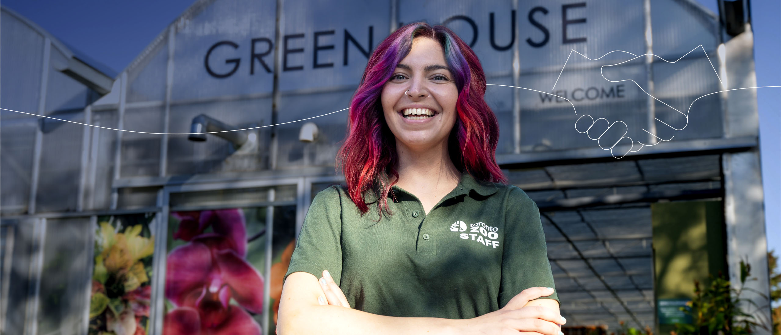 female Toronto Zoo employee outdoors infront of greenhouse